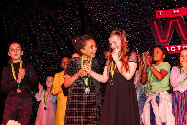 Best group winners Aissatou and Billie from Year 6, who sang and danced to This is Me from the film The Greatest Showman