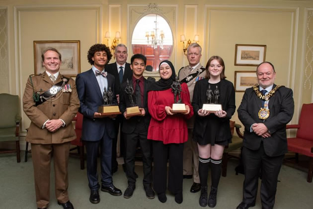 Left to right - Major Michael Tattersall, Marley Billing-Delapenha (16), Cllr David Morton (back), Vince Bigas (16), Bayan Al-Ghazzouli (15), Capt Rudy Vandaele-Kennedy (back), Eleanor Winter (16) and H&F Mayor PJ Murphy