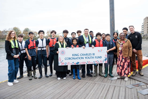 L-R: Julia Philipson FRBC Chief of Community Development, H&F Deputy Leader Cllr Alex Sanderson, H&F Leader Cllr Stephen Cowan (centre), Mayor Cllr Sharon Holder and Adam Freeman-Pask FRBC Chief Executive Officer join rowers from Hammersmith Academy at Fulham Reach Boat Club