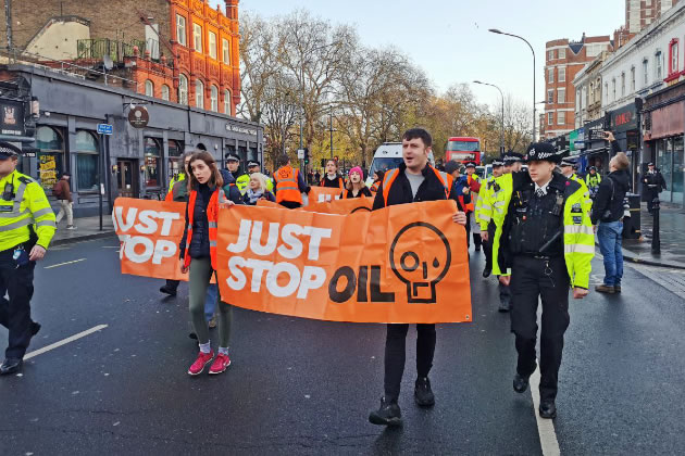 The group walking along Goldhawk Road 