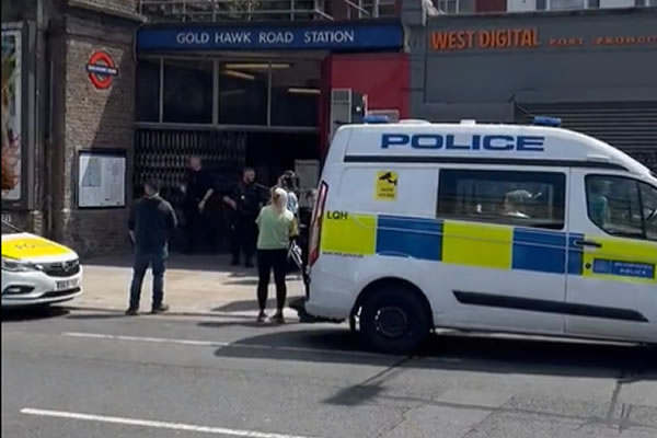 Officers with machine guns in Shepherd's Bush