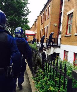 Police officers on raid in Shepherd's Bush