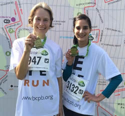 Robin Percy and colleague with medals from Ealing Half Marathon