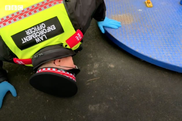 Officer checking under equipment in playground. Picture: BBC London
