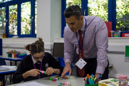 Pupil and teacher at Wood Lane High in White City